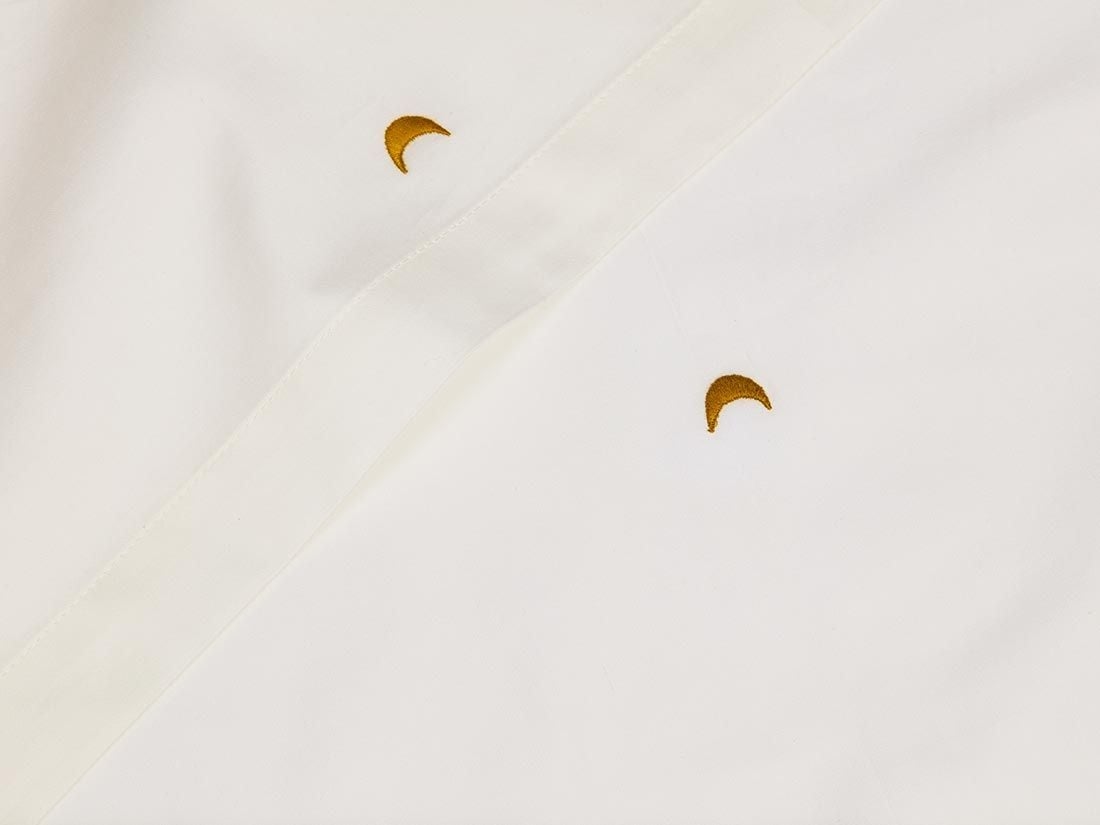 Kinderbettlaken Baumwollsatin Warm White/Ochre Moon