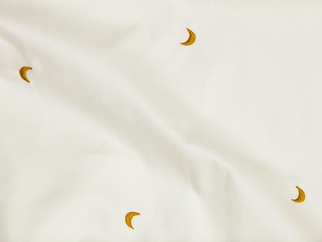 Kinderbettlaken Baumwollsatin Warm White/Ochre Moon